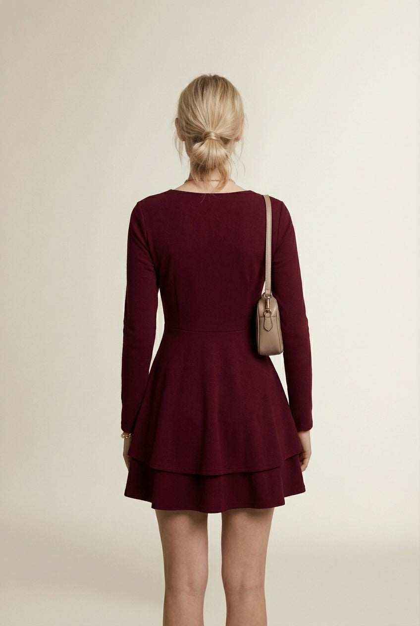 Back pose of the model wearing CAPUCINE | Robe courte évasée a volants