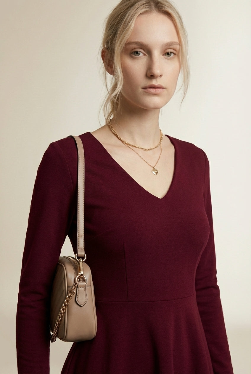 Close-up of the model wearing CAPUCINE | Robe courte évasée a volants