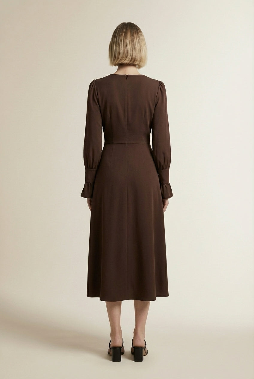 Back pose of the model wearing CAMILLE | Robe longue élégante a détails patchwork