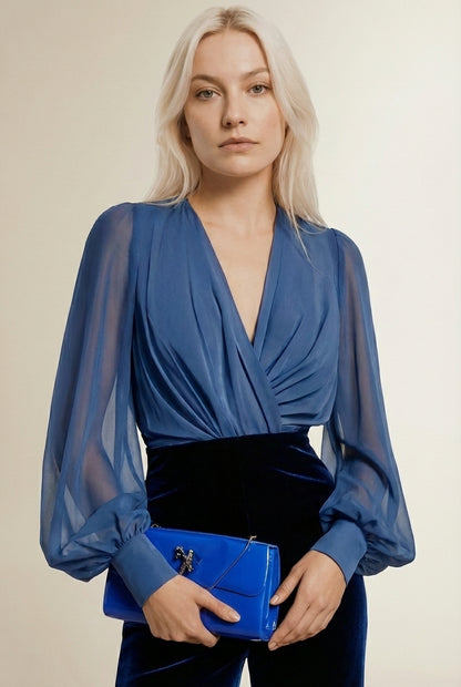 Close-up of the model wearing TINA | Combinaison Cocktail – Transparence & Plissés Sculptants